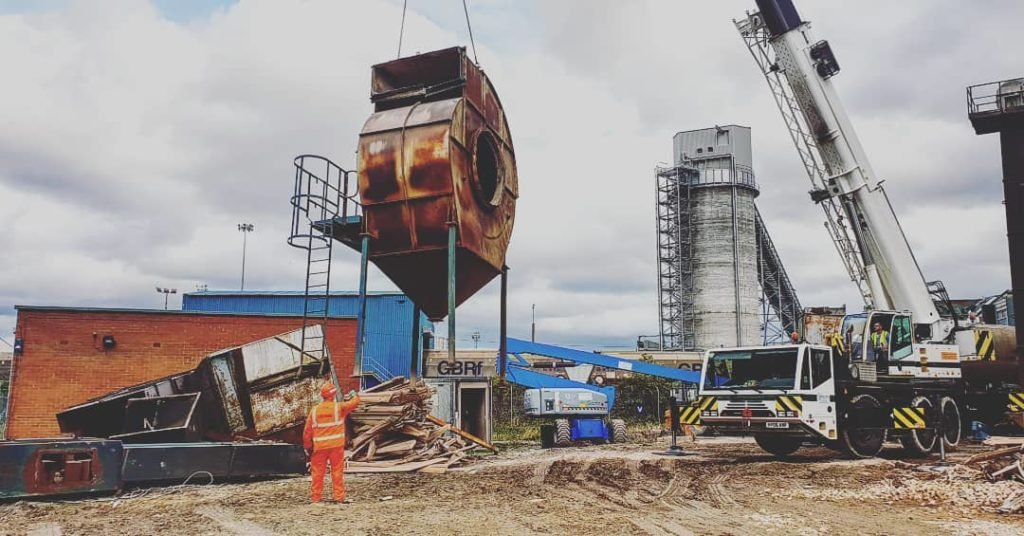 Mobile crane lifting down a section of the batching plant at the Port of Tyne