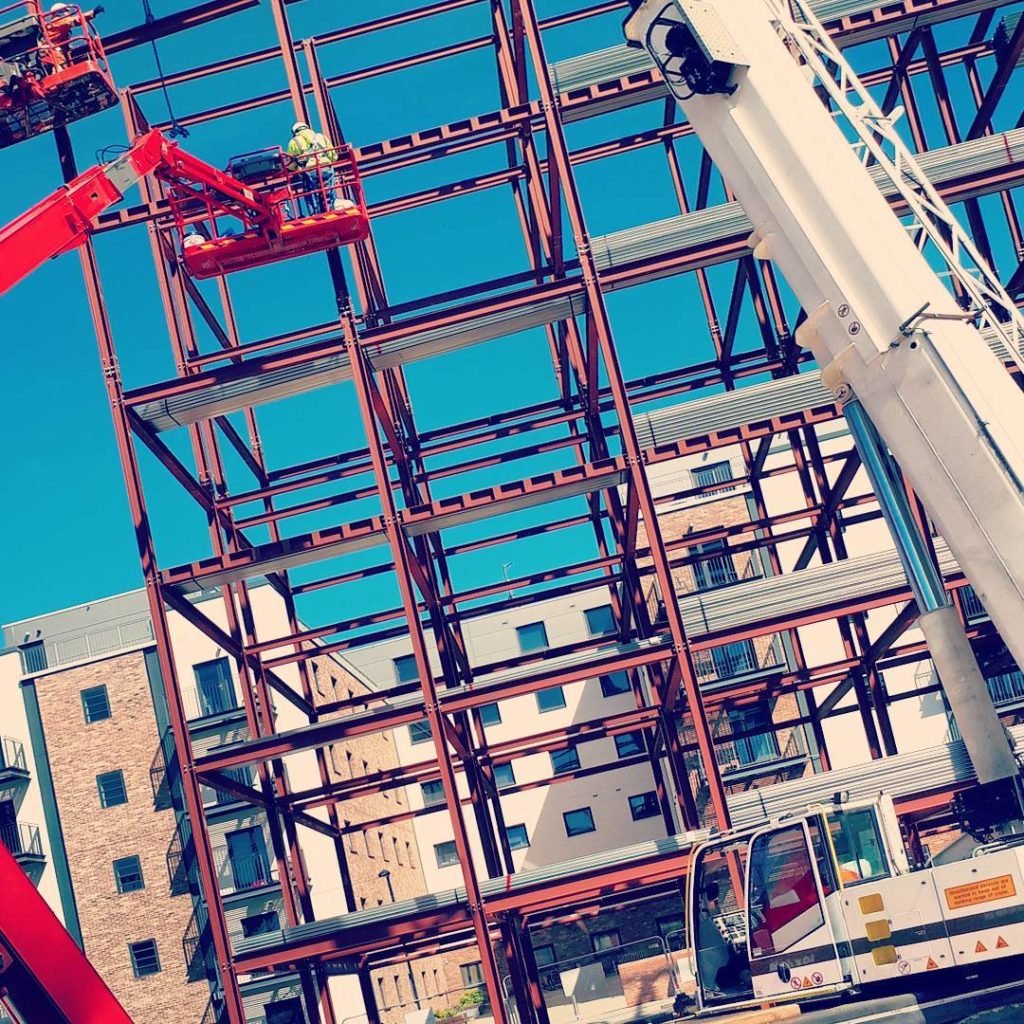 Steel frame of a student accommodation building on Union Street, Newcastle, with a MEWP