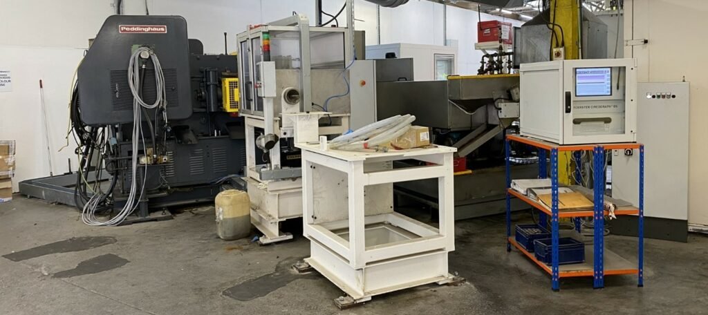 CNC and production machines in the pin factory awaiting removal
