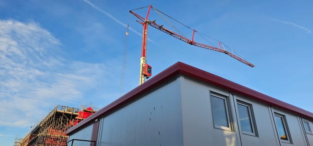 Mobile tower crane lifting plant onto a rooftop plantroom in Blyth