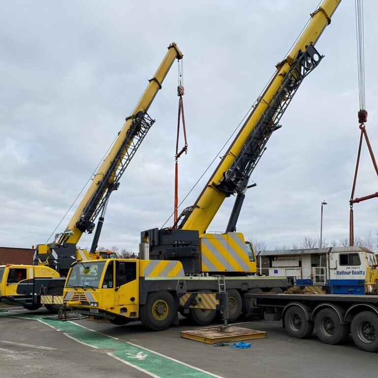 Demag AC 100-4L and Terex AC 140 Compact set up side by side for a tandem lift