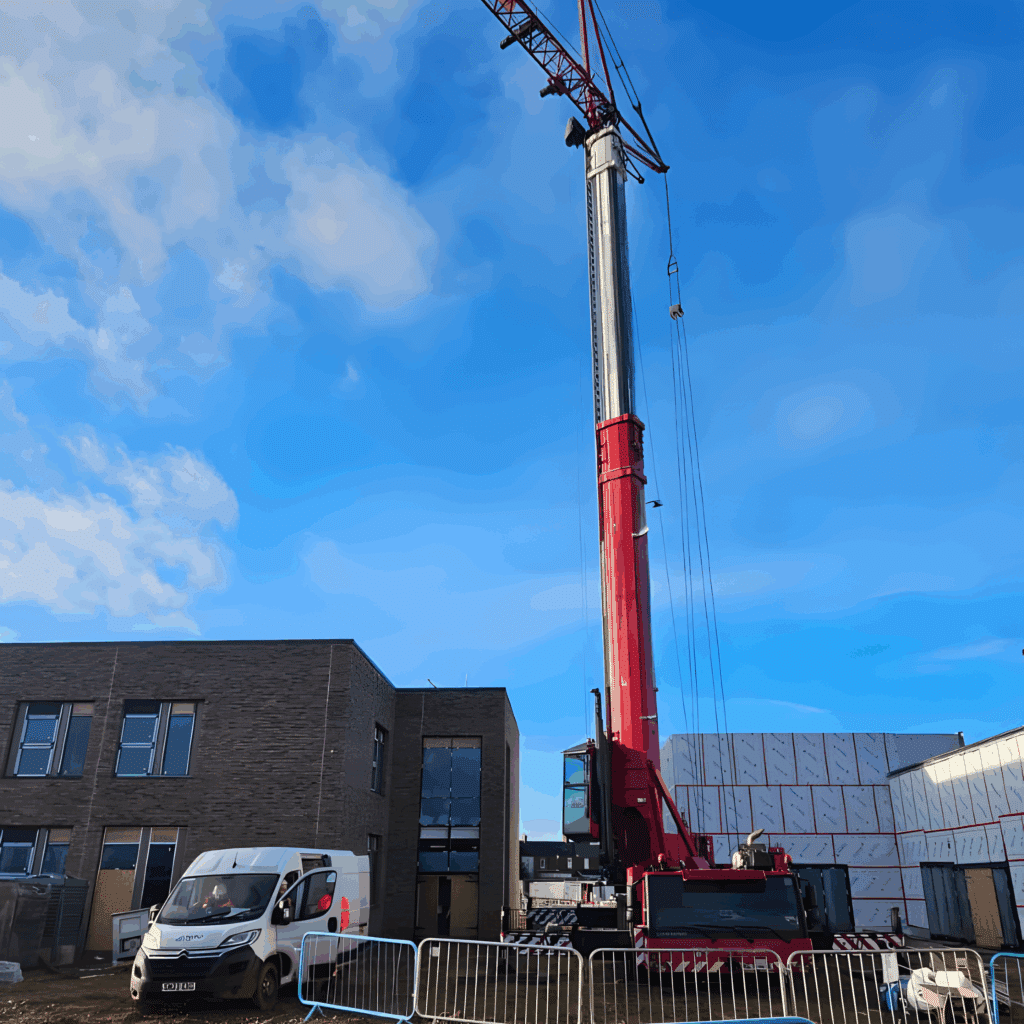 50m mobile tower crane set up beside a new school building in Whitley Bay
