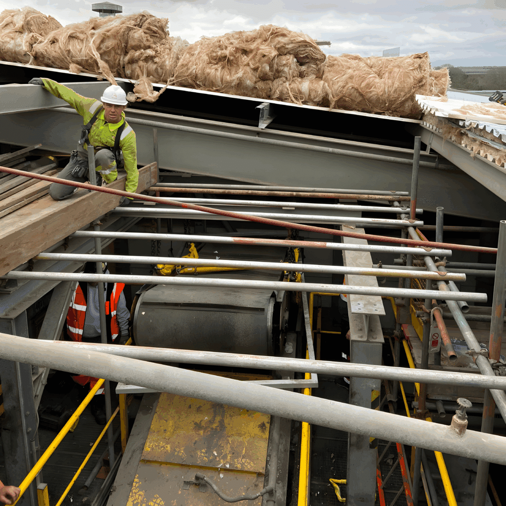 Purlins removed above the magnetic belt conveyor at roof level