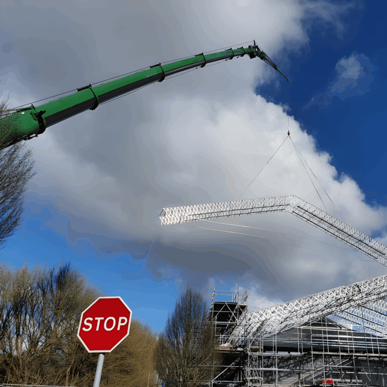 Mobile crane lifting a scaffolded roof section over the gymnasium at Tidworth
