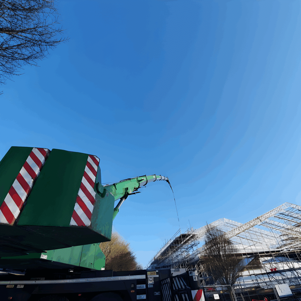 View along the crane boom towards the scaffolded roof