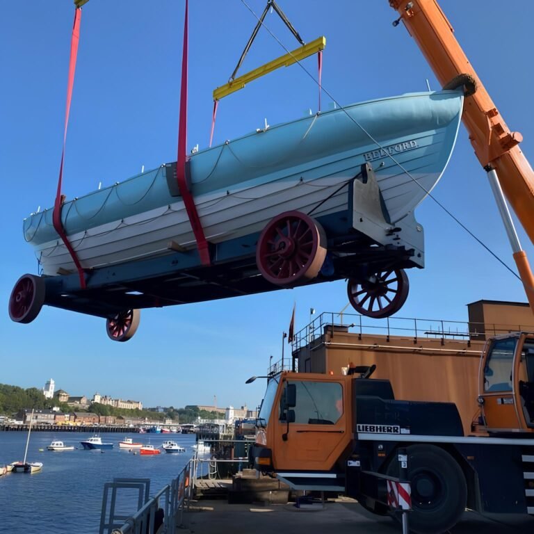 The Bedford lifeboat and her carriage lifted from transport by a mobile crane in South Shields