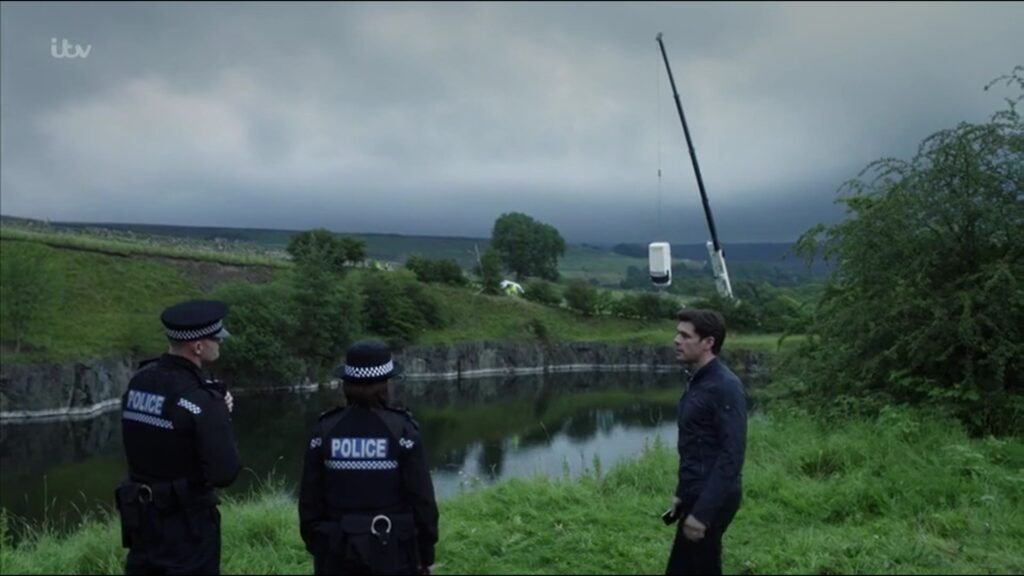 Our Demag AC 50-1 50te crane lifting a van from the lake at Greenfoot Quarry during filming of ITV's Vera