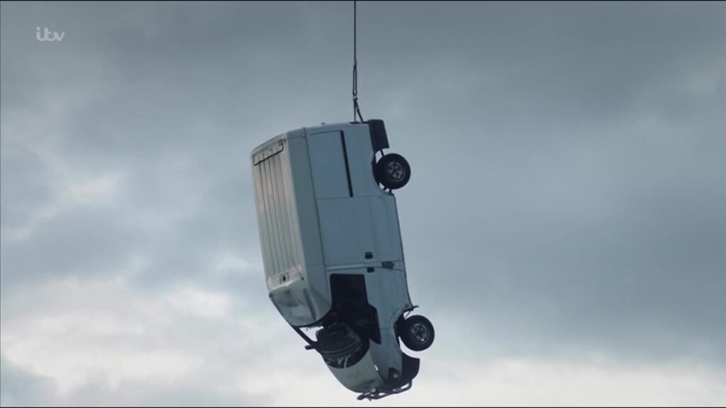 Van hanging from the crane hook above Greenfoot Quarry in ITV's Vera